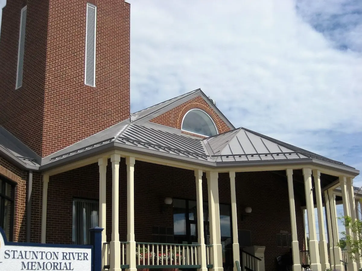 Skilled roofing craftsmen working on a residential roof in Dekalb